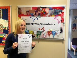 Adele Baskerville holding our certificate at the Dougie Mac Business Partnership Awards