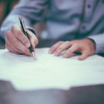 Man writing on paper